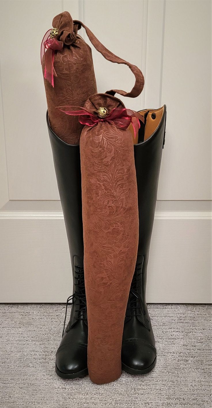 "Are your English Riding Boots flopped on the floor of your closet, in the tack room, or stable? Well, no more. Our Boot Trees will keep the shape of your Riding Boots standing upright and tall. And, oh so, pretty. HIGHLIGHTS: These Boot Trees are specifically shaped to fit into English Riding Boots.  They are 22\" high and fit nicely for narrow- and regular-size calf  Riding Boots. And they have a 6 inch strap so you can hang up the Boot Trees when you're not using them.  These gorgeous boot tr Pretty Highlights, English Riding Boots, Boot Tree, Boot Stand, English Riding, Tack Room, Riding Boot, Soft Brown, Suede Fabric