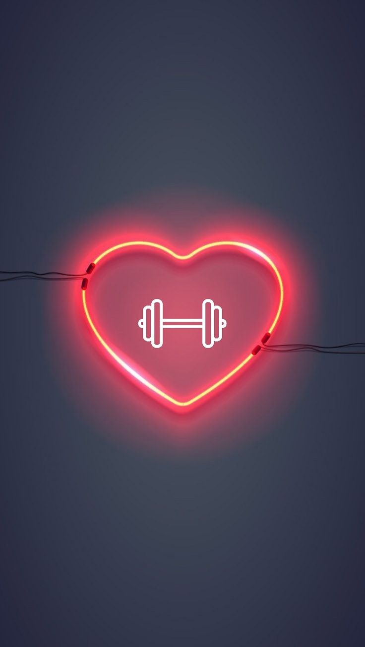 a heart shaped neon sign with a barbell on it