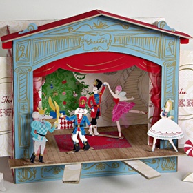 a paper doll house with people in it