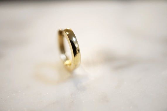 MADE WITH LOVE IN LOS ANGELESPREMIUM QUALITYSHORT WAIT TIMESSOLID 14K GOLDHuggie Dimensions: ● Outer diameter approximately 12 mm● Inner diameter approximately 8.5 mm● Hoop thickness 2 mmSmaller size 10 mm below↓https://www.etsy.com/listing/668572970/14k-solid-gold-huggie-earrings-dainty?ref=shop_home_active_10&frs=1More minimal, chic, simple pieces are available in our shopMade to order. Proudly it ONLY will take 1-3 business day to shipFeel free to message us with any questions or to custo Stackable Huggie Earrings For Gift, Small Hoop Stackable Huggie Earrings As Gift, Dainty Everyday Huggie Rings, Everyday Stackable Huggie Rings, Hypoallergenic Huggie Rings, Minimalist Stackable Huggie Earrings For Anniversary, Minimalist Huggie Cartilage Earrings For Wedding, Minimalist Huggie Septum Ring Gift, Stackable Huggie Rings Perfect For Gifts