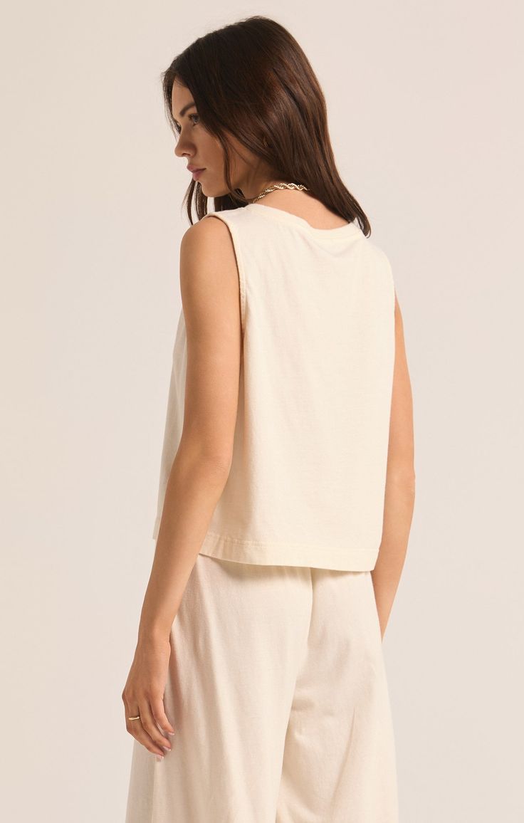 Our popular Sloane V-Neck Top now comes in this flattering v-neck version. Lightweight and made of cotton jersey fabric, this relaxed top is a versatile and effortless everyday piece, meant to be worn on its own. Palm Green, Maxi Jumpsuit, Athleisure Tops, Silk Bottoms, Cotton Jersey Fabric, V Neck Tank Top, Leather Denim, Neck Crop Top, Pullover Jacket