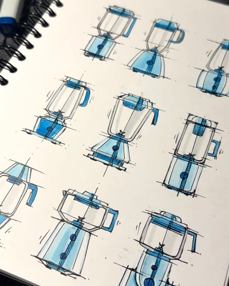 a notebook with sketches of coffee makers and blenders in blue ink on top of it