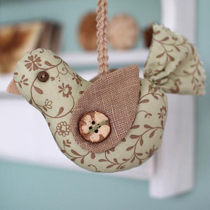 a bird decoration hanging from a rope