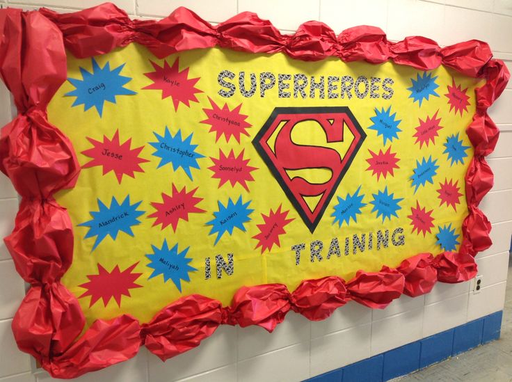 a bulletin board with the words superheros in training written on it and a superman symbol