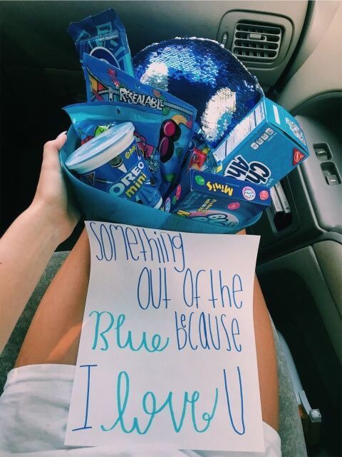 a person holding a sign in their car with the message i love you on it