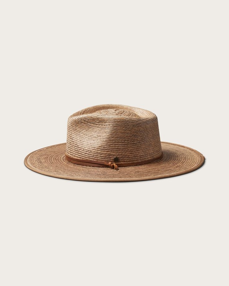 Discover the perfect blend of style and practicality with our Morro Fedora, handwoven by artisans from 100% tripilla palm straw. This lightweight accessory features a low depth fedora crown and an adjustable leather drawstring, making it an ideal choice for beachgoers and pool loungers alike. Brimmed Fedora With Braided Toquilla Straw, Braided Toquilla Straw Brimmed Fedora, Braided Toquilla Straw Fedora, Adjustable Coastal Straw Hat Made Of Toquilla, Handwoven Toquilla Straw Boater Hat, Adjustable Brown Paper Straw Fedora, Brown Woven Toquilla Straw Panama Hat, Handwoven Toquilla Straw Fedora In Natural Color, Handwoven Natural Toquilla Straw Fedora