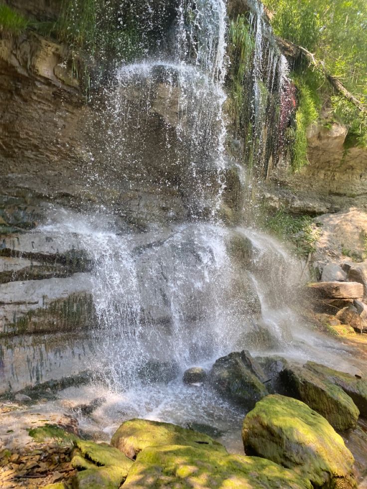 a waterfall with lots of water coming out of it