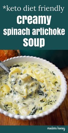 creamy spinach artichoke soup in a white bowl with a spoon on top