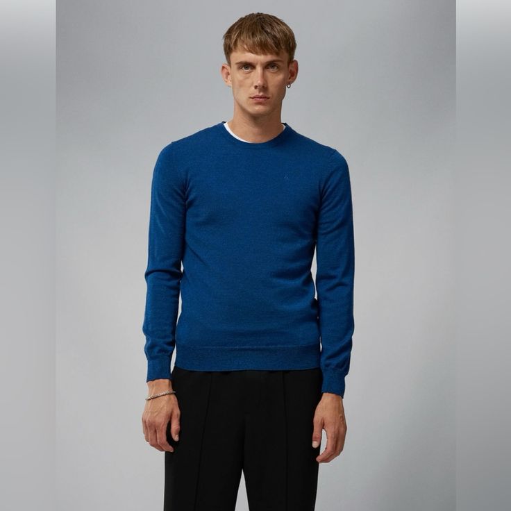 One Of J.Lindeberg's Iconic Carry-Over Classics, The Lyle Crewneck Has Been Crafted With Luxurious, Mulesing-Free Merino Wool. Slim Fitting, Stylish And Soft To The Touch, This Finely Knitted Sweater Works Perfectly Alone Or When Styled As A Layering Piece. - Mulesing-Free Merino Wool Crewneck - Long Sleeves With Tilted Shoulders - Tonal Embroidered Logo At Chest - Ribbed Trims - 12gg Tollegno Yarn - Slim Fit - No. Fmkw06424 This Item Is Final Sale Color: Nautical Blue Mouline Classic Blue Sweater With Ribbed Cuffs, Classic Blue Winter Top, Classic Fitted Blue Sweater, Classic Blue Fitted Sweater, Blue Fitted Classic Sweater, Merino Sweater, J Lindeberg, Sweaters Crewneck, Knitted Sweater