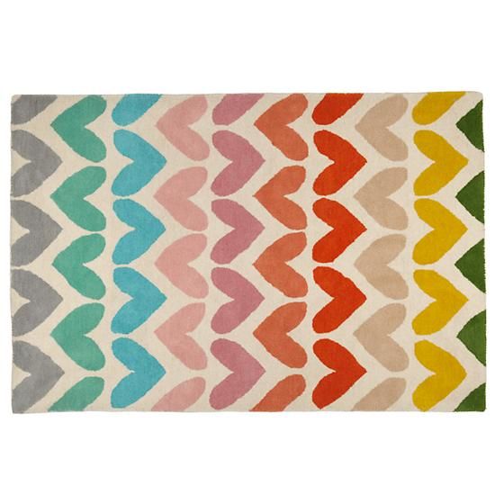 a multicolored rug with wavy shapes