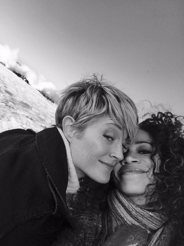 two women are posing for a black and white photo