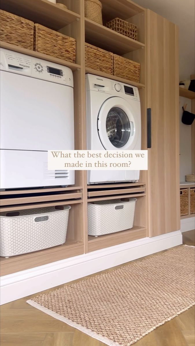 a washer and dryer in a room with baskets