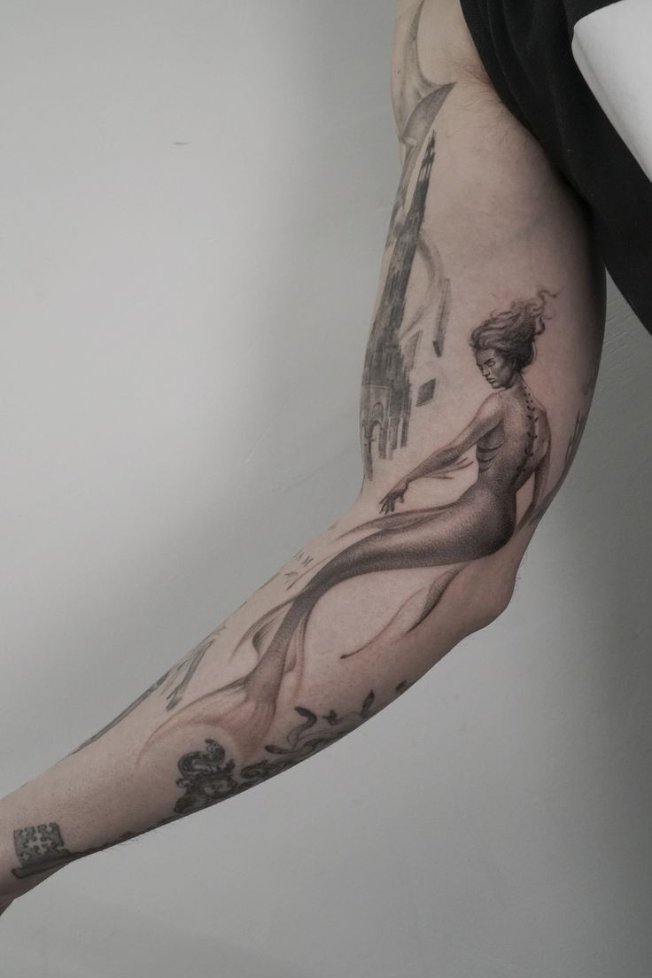 a person with a tattoo on their arm