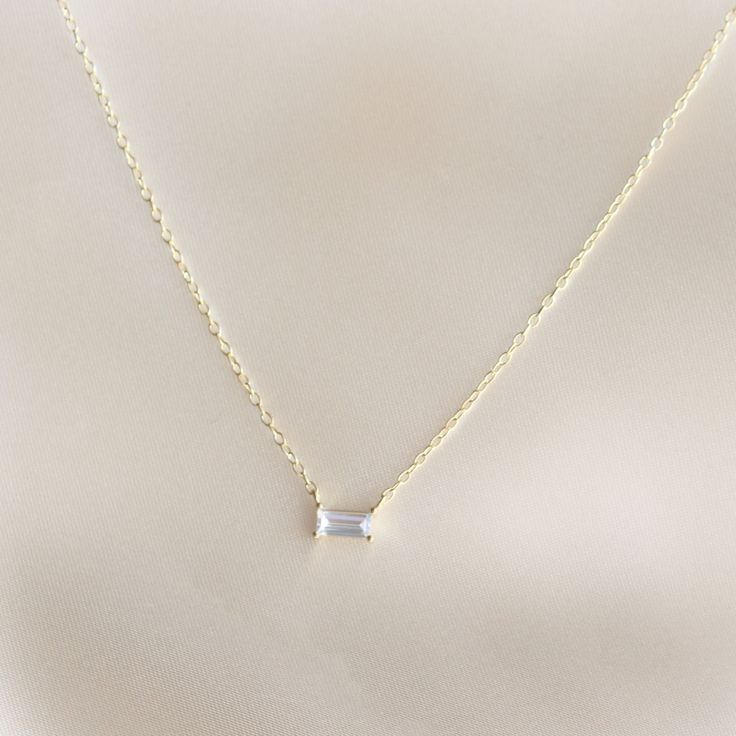 Rectangle Diamond Gold Chain Necklace- Featuring a Rectangle Diamond Necklace, dainty and perfect for any occasion- Length: 40 + 5cm- Base Material: High Quality .925 Sterling Silver- Finish: 18K Gold - Nickel Free - All our jewelry is packaged in gift ready boxes. If you would like multiple items from your order packaged separately please let us know!© 2023 Generation of Daughters Rectangle Diamond Necklace, Diamond Gold Necklace, Rectangle Necklace, Necklace Everyday, Dainty Gold Necklace, Gold Jewelry Necklace, Gold Diamond Necklace, Diamond Gold, Necklace Dainty