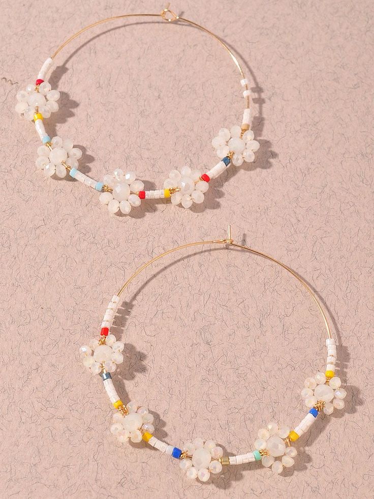 Welcome springtime blooms with the White Flower Power Beaded Hoop Earrings! Bohemian Small Hoop Earrings For Spring, Spring Beaded Flower Earrings For The Beach, Bohemian Beaded Flower Earrings For Spring, White Beaded Earrings For Spring, Spring Beach Jewelry With Flower Decoration, White Flower Beaded Earrings For Spring, Beaded Hoop Earrings For Spring, Bohemian White Beaded Earrings For Spring, White Flower Hoop Earrings For Spring