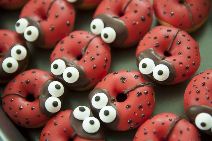 red donuts with chocolate sprinkles and googly eyes