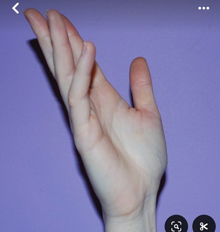 a person's hand reaching up into the air