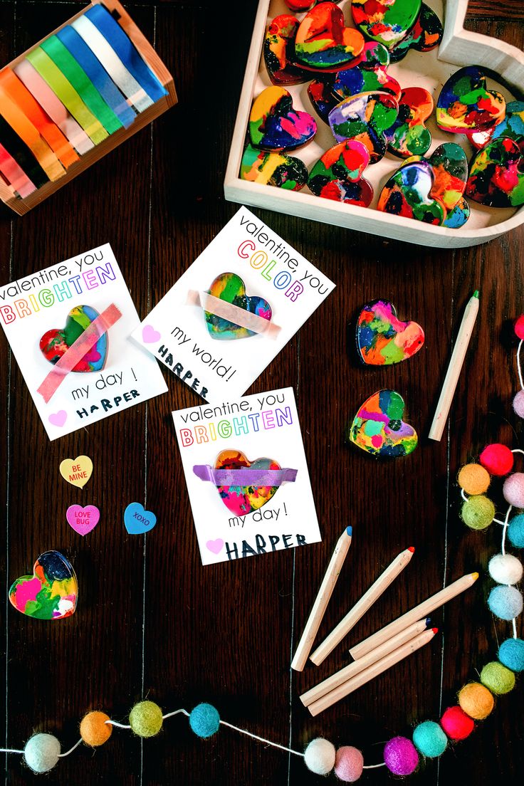 the table is filled with different colored candies and other crafting supplies for kids to make