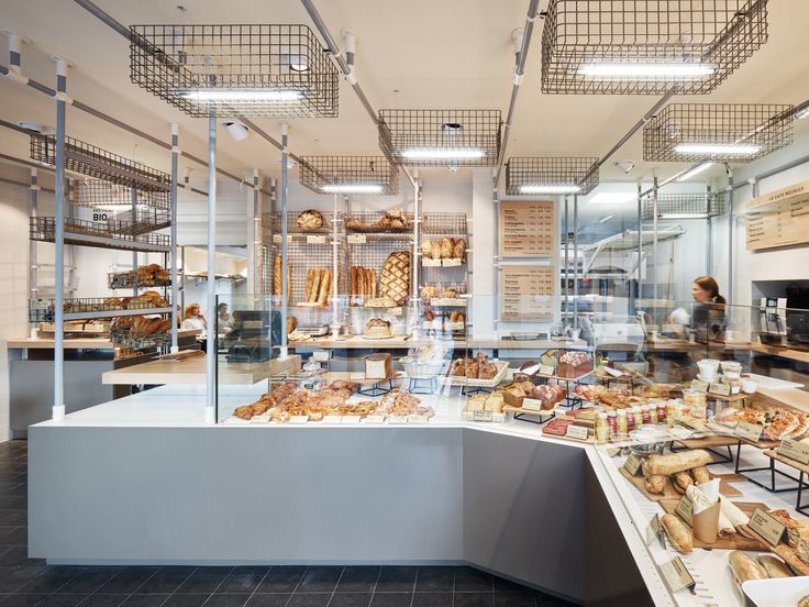 a bakery filled with lots of different types of bread