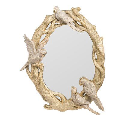 a mirror with birds on it in the shape of a tree branch and two doves