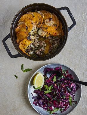 a bowl of food next to a pan filled with meat and vegtables