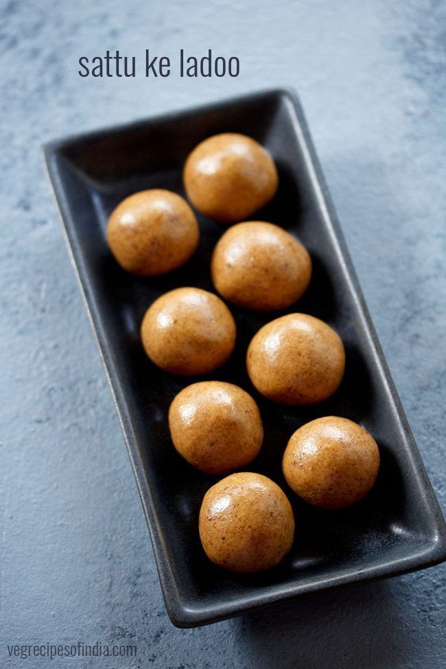 some brown potatoes in a black bowl on a blue counter top with the words sattu ke lado above it