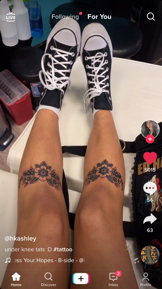 the legs and ankles of a woman with tattoos on her feet are seen in this screenshot