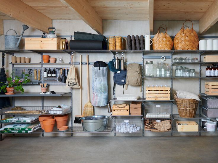 the shelves are filled with pots, pans and other items