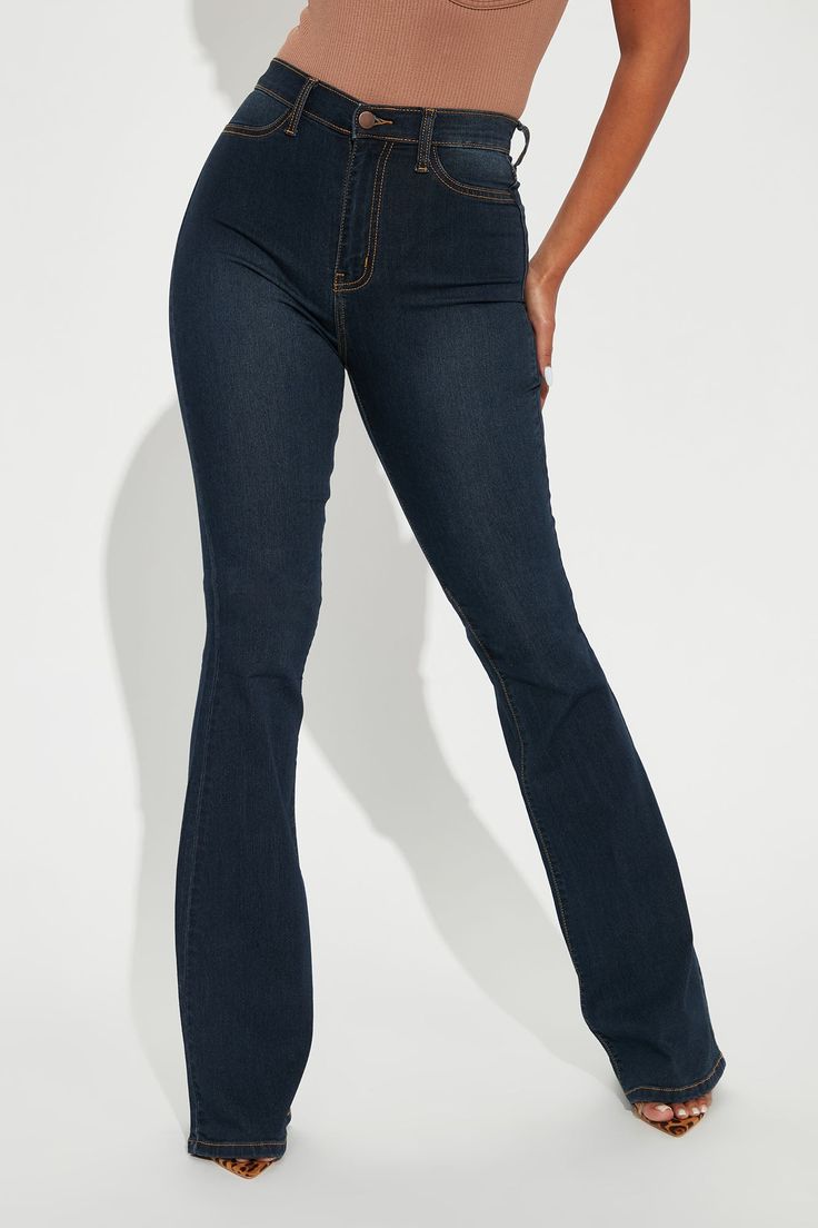 Our sexiest flare jean is offered in a range of washes in a high stretch, super soft fabric that hugs every curve. Fitted in the hips and thighs while flaring at the knee, these jeans elongate the legs and are perfect with a heel. Now offered in a range of washes, colors, and inseams. Available In Multiple Washes Available In Petite 31" Inseam, Regular 34" Inseam, & Tall 37" Inseam High Stretch Denim 11.5" High Rise 22" Flare Leg Opening Faux Front Pockets Functional Back Pockets Disclaimer: Due Stretch High Rise Medium Wash Flares, Trendy Stretch Denim Blue Flares, Stretch Medium Wash Jeans With Flare, Stretch Denim Flares For Fall, High Rise Stretch Dark Wash Flares, Stretch High Rise Dark Wash Flares, Dark Wash Stretch High Rise Flare Jeans, Stretch High Rise Flare Jeans In Dark Wash, Dark Wash Stretch Flare Pants