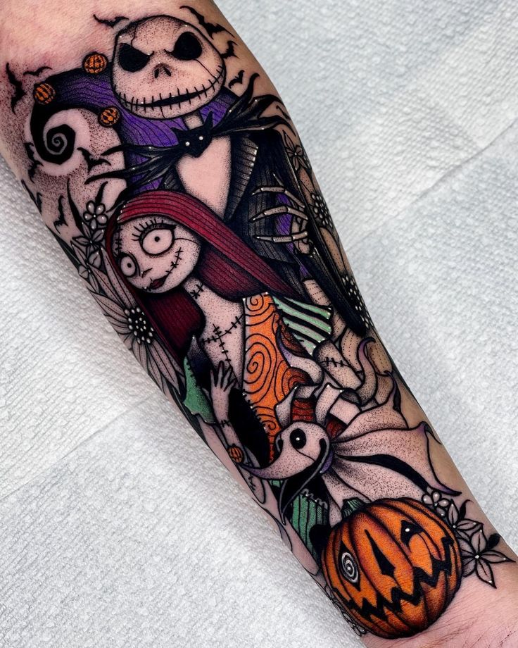 a person with a halloween themed tattoo on their arm