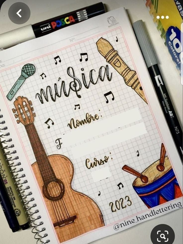 an open notebook with musical instruments on it