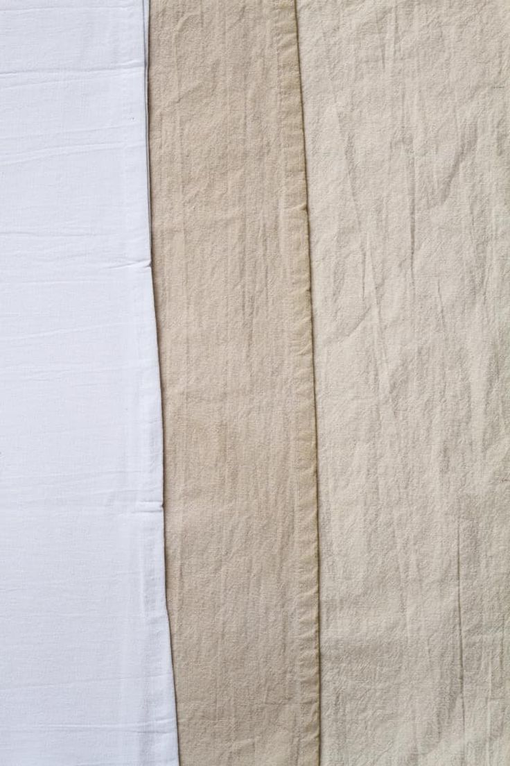 three pieces of white linen are lined up against each other