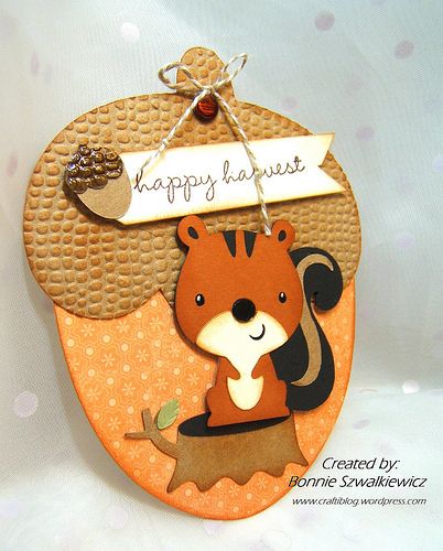 a card with a squirrel on it and a happy harvest tag hanging from the front