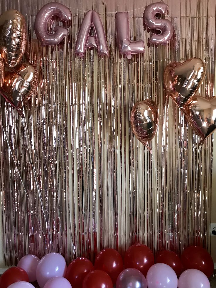 balloons and streamers are arranged in front of a backdrop with the word salsa on it