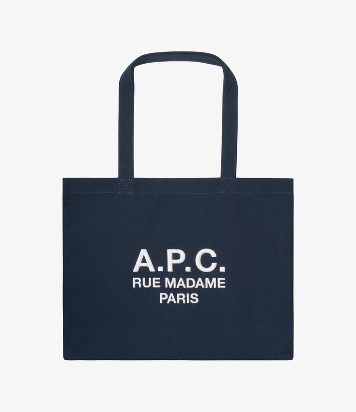 - Unisex model. - Two large handles to carry the bag by hand or on the shoulder. - One interior pocket. - 'A.P.C. Rue Madame Paris' logo embroidered on the front. - 100% recycled polyester. Paris Logo, Recycled Canvas, Dark Navy Blue, Logo Embroidered, Dark Navy, A P, Handles, Navy Blue, Tote Bag