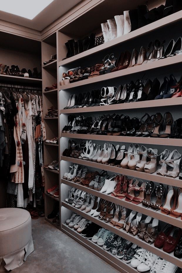 a closet filled with lots of different types of shoes