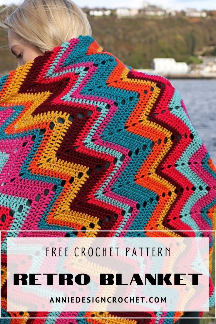 a woman wearing a colorful crochet blanket with text overlay that reads free crochet pattern retro blanket