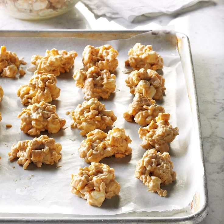 several cookies are on a baking sheet ready to be baked in the oven or used as an appetizer