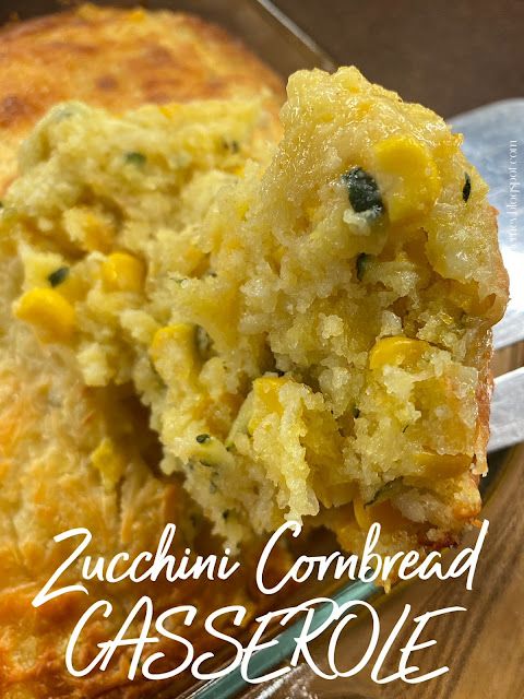 a piece of zucchini cornbread casserole on a plate with a spoon