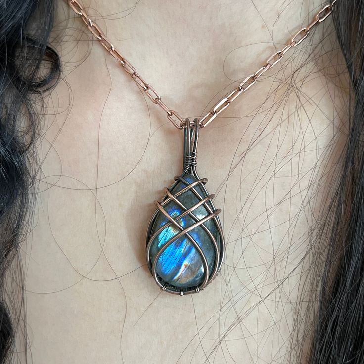 Beautifully Handmade Copper Wire Wrapped Labradorite Gemstone Pendant Necklace Gemstone - Labradorite Gemstone Creation - Natural Each Stone have their own shade and shape (You Can receive Slightly Different Size Stone) Pendant Size - 4.5 centimeters Handmade Pendant You can Gift this Pendant to your Loved Once If You Have Any Confusion you can contact me anytime I Can Make Pendant in every stone , I Make All type Customized Jewelry Please review this design It takes 4-6 hours in making, Hope yo Wire Wrapped Stone Jewelry, Blue Sapphire Pendant, Handmade Pendant Necklace, Wrapped Necklace, Emerald Pendant, Pendant With Chain, Wire Wrapped Necklace, Sapphire Pendant, Copper Chain