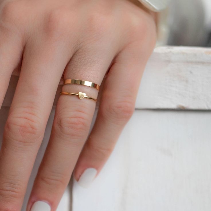 Our super fine and dainty heart Gold filled ring is perfect for a minimalist statement. So versatile our heart ring is great for stacking and pretty enough to stand on it's own. Mix and Match to stack your favourite rings. Simple, clean and so pretty 14 Karat Gold Filled Heart ring. Won't tarnish! Ring sizes 6 through 8 available. Rings sold as individuals if you would like multiple please select from drop down menu. * ＤＥＴＡＩＬＳ - 14k gold filled - Ships next business day - Made in Oakville, ON. * Minimalist Heart Shaped Stackable Promise Rings, Minimalist Rings With Heart Charm For Everyday, Everyday Minimalist Rings With Heart Charm, Minimalist Everyday Ring With Heart Charm, Minimalist Everyday Heart Ring With Charm, Everyday Minimalist Ring With Heart Charm, Minimalist Midi Rings With Heart Charm For Promise, Minimalist Heart Charm Ring For Everyday, Minimalist Midi Rings With Heart Charm For Wedding