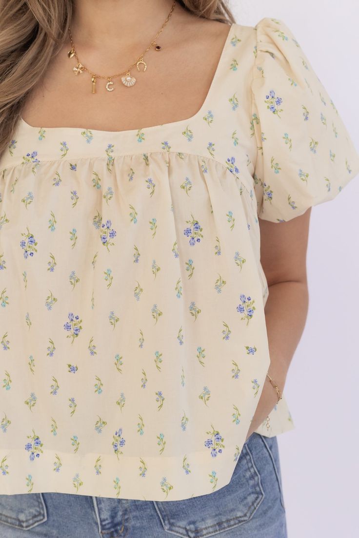 Description Elevate your wardrobe with our delicate DAINTY FLORAL BABYDOLL TOP. The skimmer babydoll top features a beautiful cream and blue floral print. The tie back adds a charming touch and allows for a customizable fit. Step into spring with style and grace! Material self: 100% cotton contrast: 100% polyester Size Chart Camille is in a small. Blue Flower Print Dress, Blue Flower Print, Floral Babydoll Top, Modest Fits, Flower Print Dress, Puff Sleeve Blouse, Blue Baby, Babydoll Top, Modest Fashion