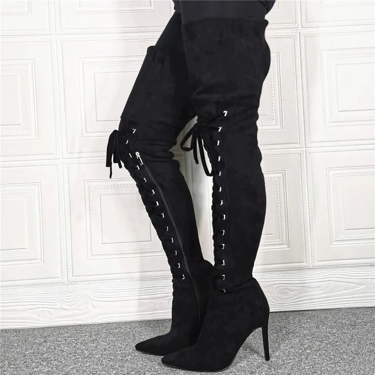 These over-the-knee boots get you ultimate comfort during the winter. The footwear is fashioned with the best quality synthetic suede upper with tempting zipper closure to elevate your overall style. Crafted with a rubber outsole and bonded leather insole, they protect your feet during various activities. These handmade boots make a bold look.Specifications is_handmade: No With Platforms: No Upper Material: Synthetic Suede Toe Shape: Pointed Toe Style: sexy Size:: 36-46 Shaft Material: Synthetic Suede Season: Winter Pattern Type: Solid Outsole Material: Rubber Origin: Mainland China Model Number: WQ321 Lining Material: Short Plush Item Type: Boots Insole Material: Bonded Leather Heel Type: Thin Heels Heel Height: Super High (8cm-up) Fit: Fits true to size, take your normal size Fashion Ele Trendy Lace-up Knee-high Winter Boots, Black Over-the-knee Boots With Zipper Closure, Fitted Knee-high Boots With Side Zipper For Fall, Fitted Knee-high Boots With Side Zipper For Winter, Fitted Winter Knee-high Boots With Side Zipper, Trendy Fitted Lace-up Boots For Winter, Winter Knee-high Boots With Side Zipper And Fitted Design, Zipper Closure Boots For Winter Nights Out, Trendy Winter Fitted Lace-up Boots