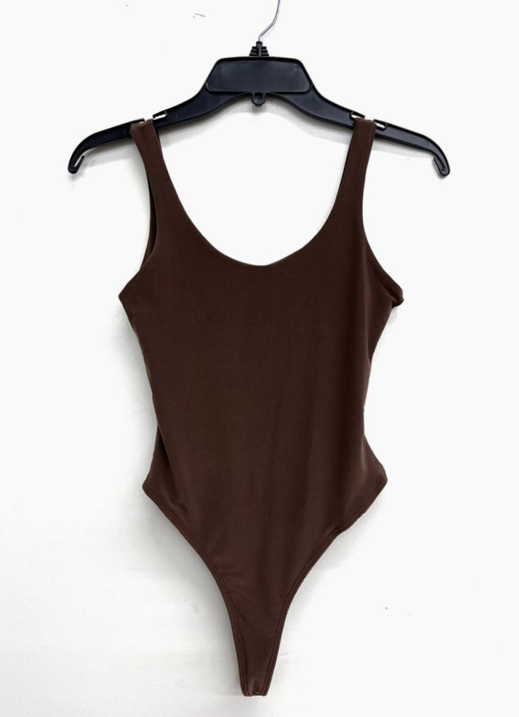 This tank style bodysuit is double lined so, it’s not see through. Great for layering under blazers and jackets. It pairs well with our Autumn Kimono Set. Or with a pair of jeans. A definite wardrobe essential. 92% Polyester, 8% Spandex Fitted Sleeveless Bodysuit For Everyday, Stretch Scoop Neck Bodysuit For Everyday, Everyday Stretch Bodysuit With Scoop Neck, Everyday Fitted Sleeveless Bodysuit, Classic Cotton Fitted Bodysuit, Fitted Cotton Bodysuit For Everyday Wear, Everyday Fitted Cotton Bodysuit, Fitted Basic Tank Top For Summer, Casual Scoop Neck Bodysuit With Lined Body