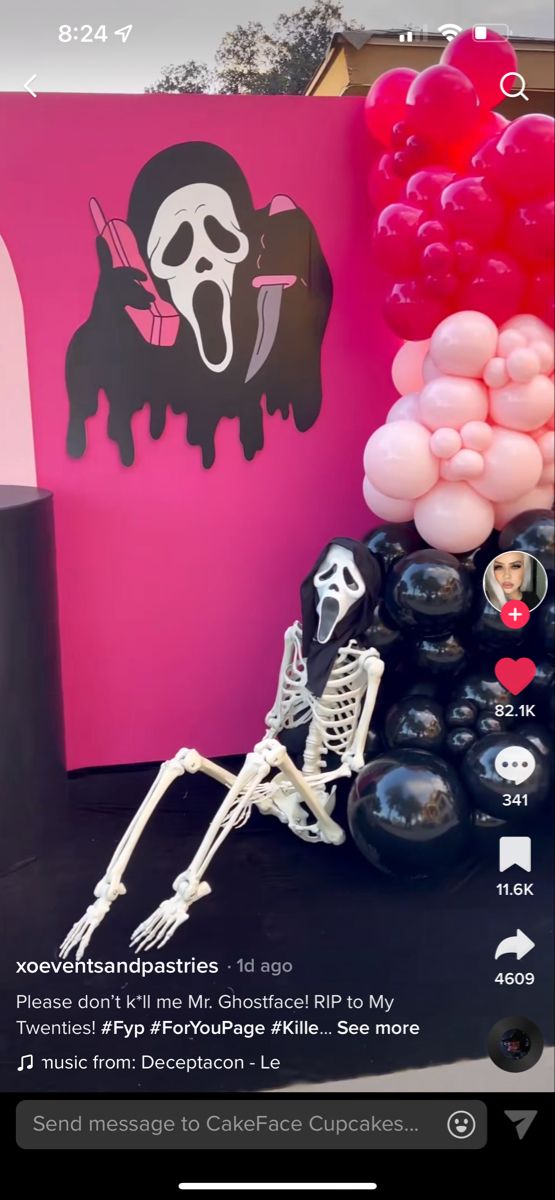 an image of a halloween party with balloons and skulls on the table in front of it