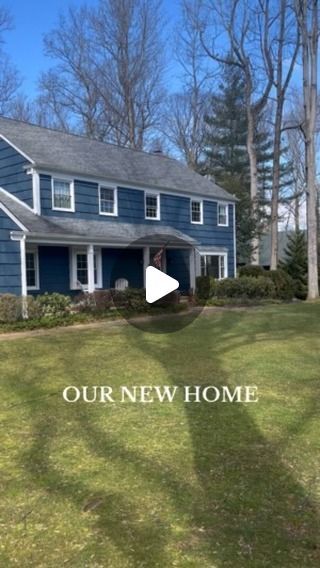 a blue house with the words, our new home on it's front lawn