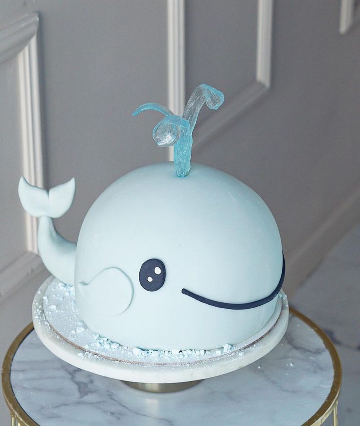 a cake shaped like a whale sitting on top of a table