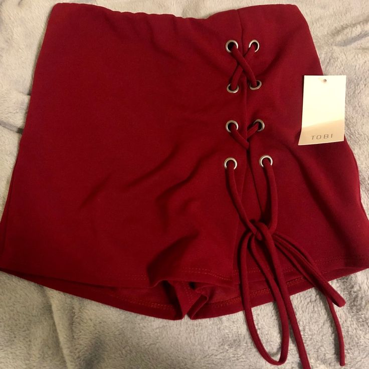 Dark Red Skort From Tobi. Never Worn- New With Tags Red Cotton Party Bottoms, Burgundy Bottoms For Summer Party, Stretch Red Bottoms For Day Out, Burgundy Casual Bottoms For Night Out, Trendy Burgundy Bottoms For Summer, Chic Stretch Red Shorts, Chic Red Stretch Shorts, Maroon Tie, Skorts