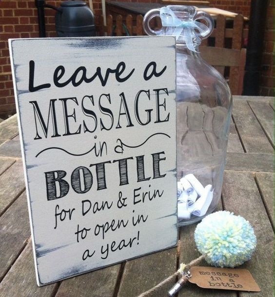 a sign that says leave a message in a bottle for dan and finn to open in a year