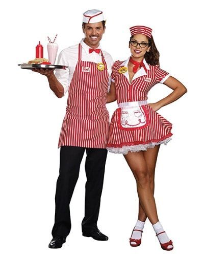 a man and woman dressed in red aprons holding a tray with food on it